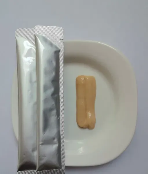 Foil retort pouches of chicken and cod recipe wet food with the contents plated