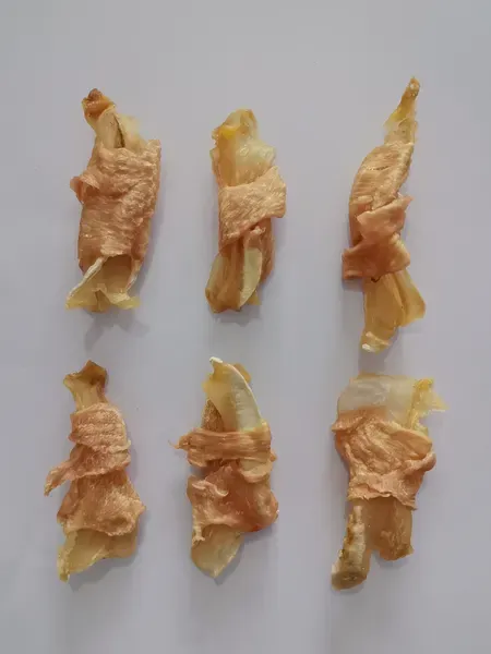 Short chicken-wrapped rawhide pieces showing the wrapping detail
