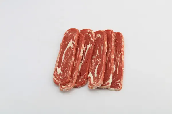 Pale rawhide sticks wrapped with strips of red meat