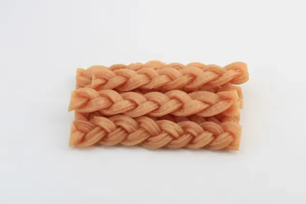 Braided rawhide chew sticks for dogs