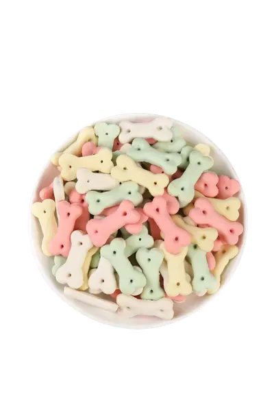 Bowl of multi-coloured bone-shaped dog biscuits