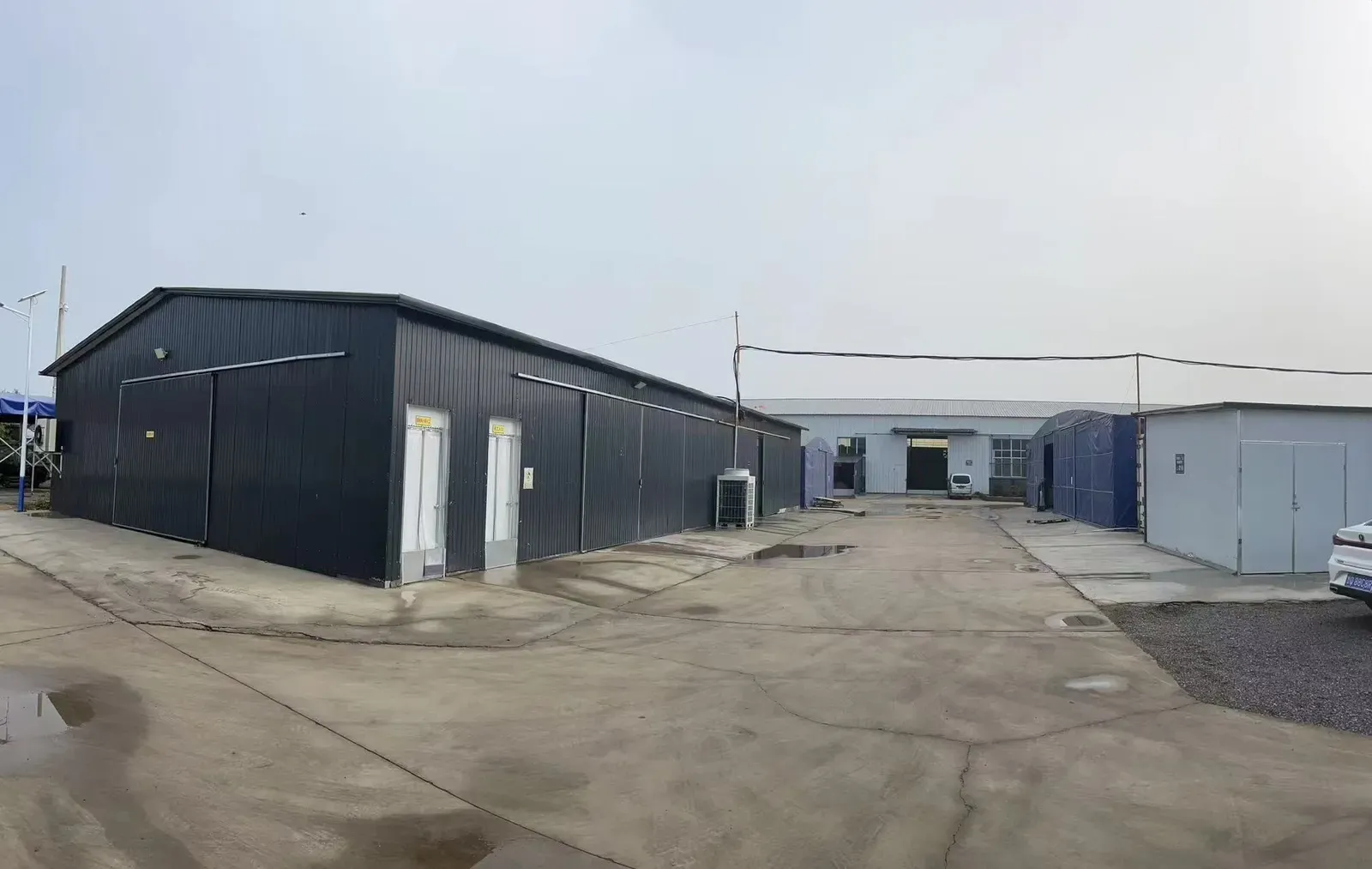 Exterior of a production workshop with access doors