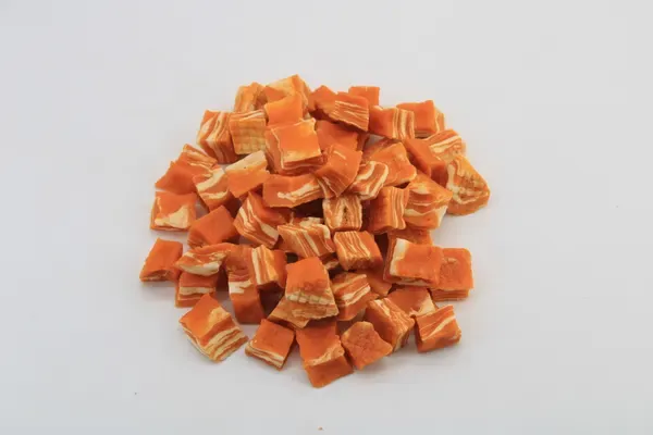 Orange salmon dice treats arranged in a pile