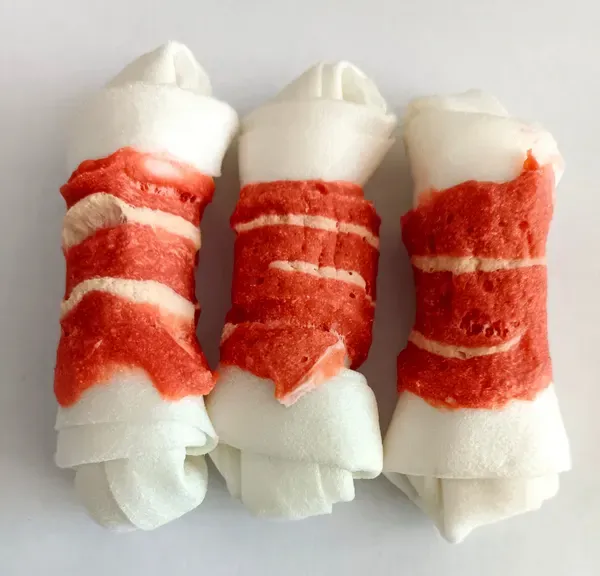 Four-and-a-half inch knotted rawhide bones wrapped with salmon