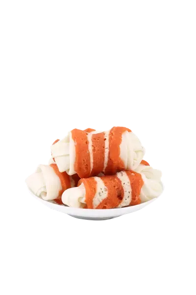 Meat-wrapped rawhide knot bones served on a white dish