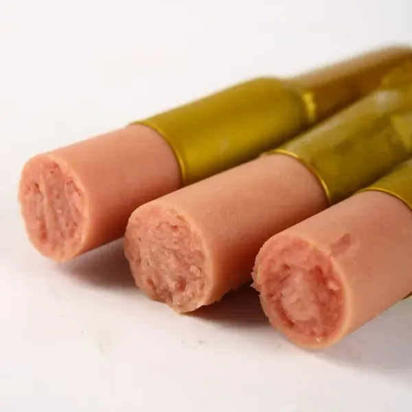 Pet sausages in olive-green casing with cut ends facing the camera